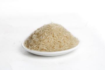 Pile of Raw Fragrant Basmati Rice Grains on White Plate - Food Ingredient Photography