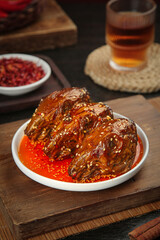Spicy Rabbit Head Chengdu Shuangliu Style - Traditional Sichuan Cold Dish with Chili Oil and Sesame Seeds