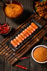 Chongqing Hot Pot Ingredients with Spicy Seasoning and Meat Slices on Bamboo Mat