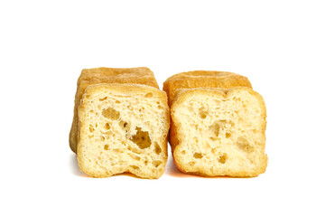 Deep Fried Golden Tofu Pieces with Crispy Texture on White Background