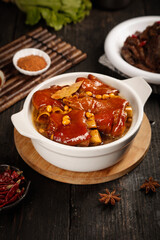Chinese Braised Pork Knuckle Stew with Soy Beans in Ceramic Bowl - Traditional Asian Cuisine