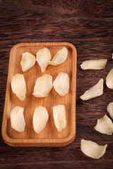 Dried White Chinese Herbal Medicine Ingredients on Wooden Tray Traditional Tonic Preparation Closeup