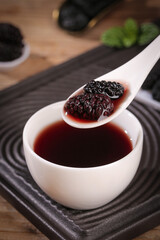 Dried Black Mulberry Fruit Tea Closeup - Traditional Xinjiang Herbal Drink Preparation