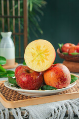 Fresh Red Apples Cut in Half on Plate - Healthy Organic Fruit Kitchen Display