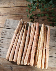 Fresh White Yam Root Vegetables in Rustic Wooden Crate on Farm Deck