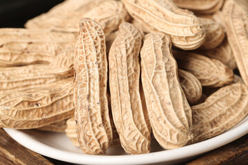 Yunnan Selenium-Enriched Peanuts in Shell on White Plate - Healthy Dried Legumes and Grains