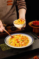Yangzhou Golden Fried Rice Chinese Specialty Dish Being Served in Traditional Kitchen