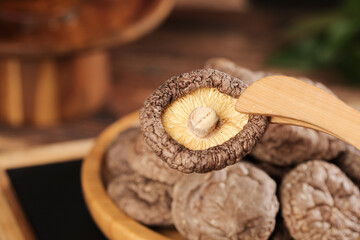 Fresh Shiitake Mushrooms with Wooden Tongs - Premium Cooking Ingredients for Culinary Arts © ChuThi