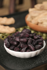Yunnan Black Selenium-Enriched Peanuts in White Bowl with Traditional Cereals and Grains