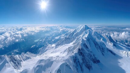 Majestic Snowy Mountain Peak Under Bright Sun With Blue Sky Cloudscape And Pristine White Snow In Cold Winter Day