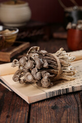 Dried Shiitake Mushrooms Bundle on Wooden Board with Traditional Kitchen Setup