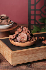 Dried Porcini Mushrooms in Wooden Bowl - Traditional Asian Cooking Ingredient