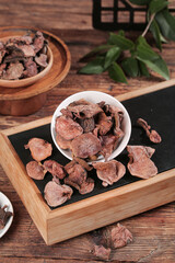 Dried Porcini Mushrooms in Bowls on Wooden Tray - Specialty Vegetarian Cooking Ingredient