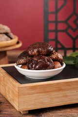 Dried Shiitake Mushrooms in White Bowl on Bamboo Tray - Fresh Asian Cooking Ingredients