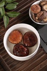 Fresh and Dried Shiitake Mushrooms in White Bowls - Healthy Cooking Ingredients