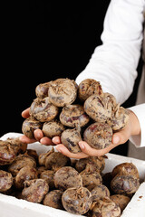 Chef Presenting Fresh Farm Red Potatoes with Soil in Hands