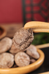 Fresh Dried Shiitake Mushrooms in Wooden Bowl with Spoon - Organic Cooking Ingredients