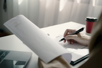 Businesswoman employer holding resume, recruiting, planning, evaluating and reviewing resume of job applicant, recruiting new employees, recruitment concept