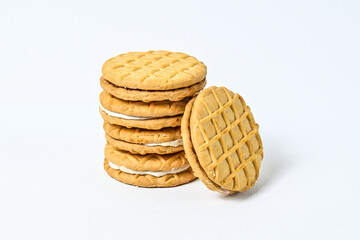 Close up view of five biscuits isolated on white background. clipping path. pile, stack. milk biscuits with jam and cream.