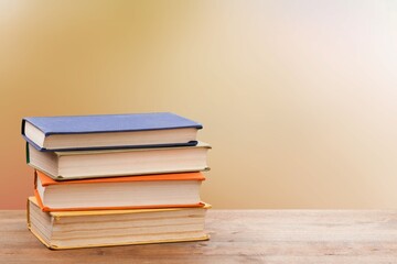 Vintage old stack books on a wooden deck