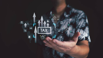 A person holds a holographic interface showing the word 'TAX' with rising arrows. Digital icons for property, finance, and data float above their hand, illustrating a futuristic concept.
