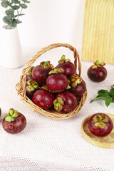 Fresh Thai Mangosteen Fruits in Wicker Basket - Exotic Tropical Produce Display Thailand