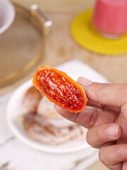 Traditional Chinese Dried Persimmon Cake from Shaanxi Fuping - Hand Holding Sweet Glazed Fruit Snack