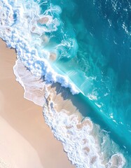 Aerial shot of waves crashing on a golden sandy beach. Turquoise water transitions to deep blue, showcasing the coastline from above
