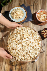 Traditional Chinese Medicine Dried Lily Herbs and Tonic Ingredients on Wooden Table