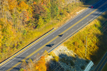 Highway road in American rural area. Expressway lanes for fast passing of car traffic