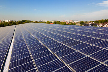 Photovoltaic panels on solar rooftops of commercial building for producing clean ecological electrical energy. Renewable electricity with zero emission concept