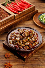 Spicy Stir-Fried Whelk Shellfish with Chili Peppers Traditional Asian Cuisine