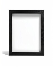 Fototapeta premium Simple, stark black wooden picture frame with a clean white center, casting a soft shadow on a solid white background