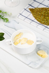 Freeze-Dried Durian Fruit Specialties in Mug with Fresh Durian on Marble Board