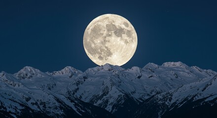Stunning full moon illuminates snow-covered mountain range under dark night sky