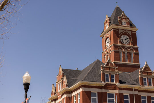 Afternoon view of the historic courthouse, constructed in 1910, standing in downtown Lyons, Kansas, USA.