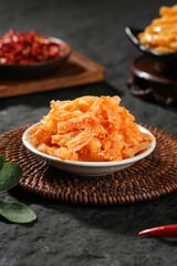 Spicy Konjac Tripe Wei - Traditional Vegetarian Asian Dish in White Bowl on Bamboo Placemat