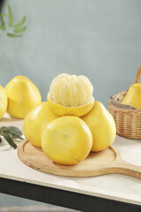 Fresh Yellow Pomelo Citrus Fruits on Wooden Board - Tropical Sweet Fruit Display
