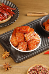 Spicy Marinated Meat Skewers and Nuggets with Star Anise on Wooden Background