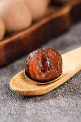 Chinese Dried Fruit with Cinnamon on Wooden Spoon - Traditional Guangdong Yunnan Ingredients