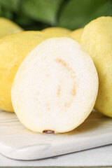 Fresh White Guava Fruit from Guangxi China Showing Soft Cream Flesh and Heart-Shaped Seeds on Cutting Board