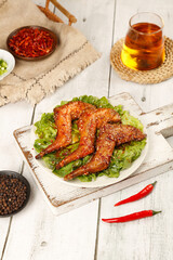 Traditional Szechuan Spiced Roasted Rabbit Legs Chinese Cuisine with Tea and Chili Peppers