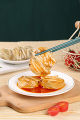 Xiamen Sea Jelly Dumplings Asian Gourmet Specialty Food with Chopsticks and Dipping Sauce
