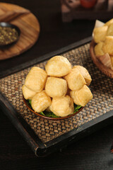 Fried Tofu Bean Curd Bubbles in Wooden Bowl Traditional Chinese Food Guangxi Style