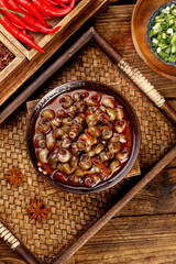 Spicy Braised Whelk Meat in Red Sauce Traditional Asian Seafood Dish with Chilies