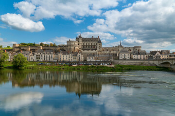 Fototapeta premium The Chateau d'Amboise and the chapel of Saint Hubert, which rise above its surrounding town on the shore of the Loire River on a summer sunny day, Amboise, Indre-et-Loire, France