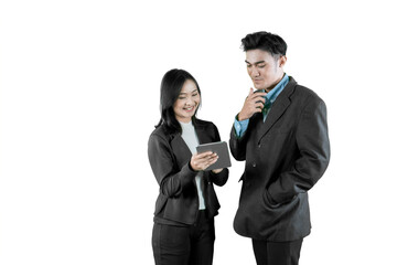 Two Asian Business Colleagues Discussing Information on a Tablet on a White Background