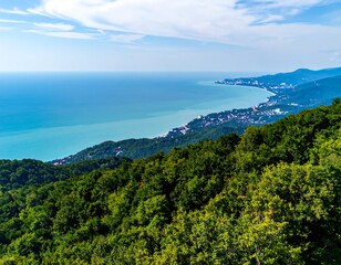 Panoramic coastal view of a turquoise sea and lush green mountains