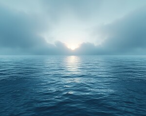 Obraz premium A serene, misty sunrise over a calm sea