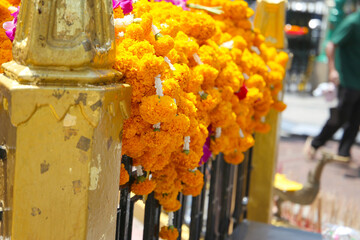 Marigold garlands offered for worship at the Erawan Shrine in Bangkok, Thailand.